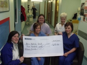 Eileen Jones donating a cheque to the neo-natal unit